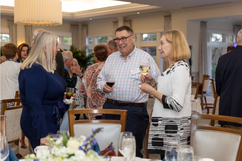William and Jean Suggs talking with other guest at event